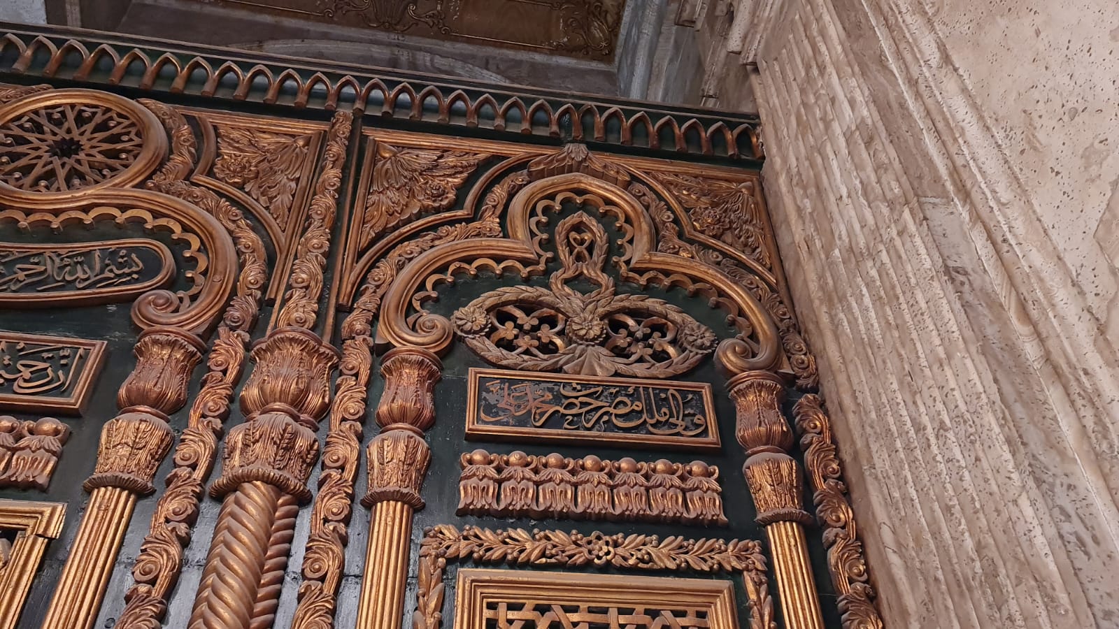 Intricately carved bronze doors of the Muhammad Ali Mosque