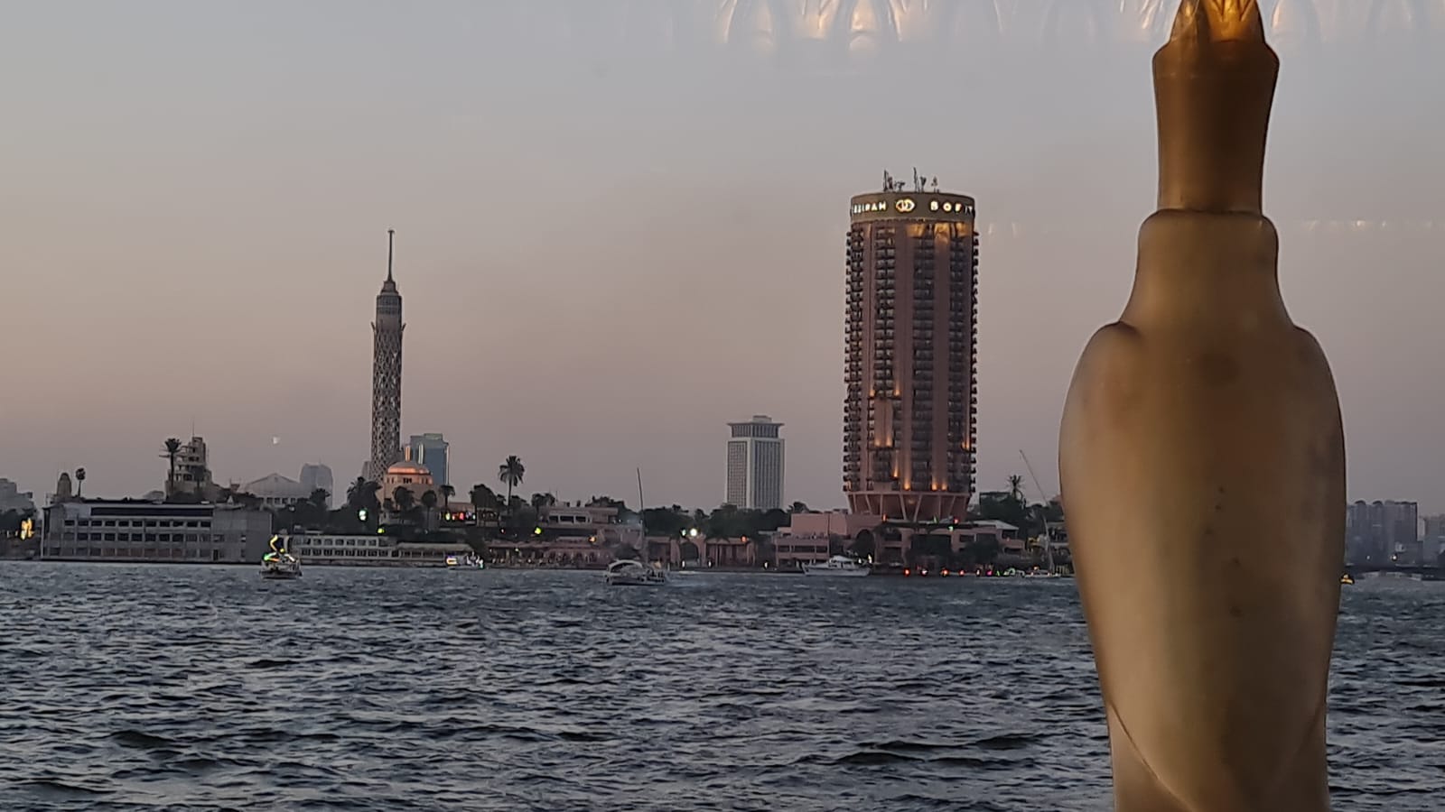 Sunset over the Nile with the Cairo Tower and Sofitel on the skyline