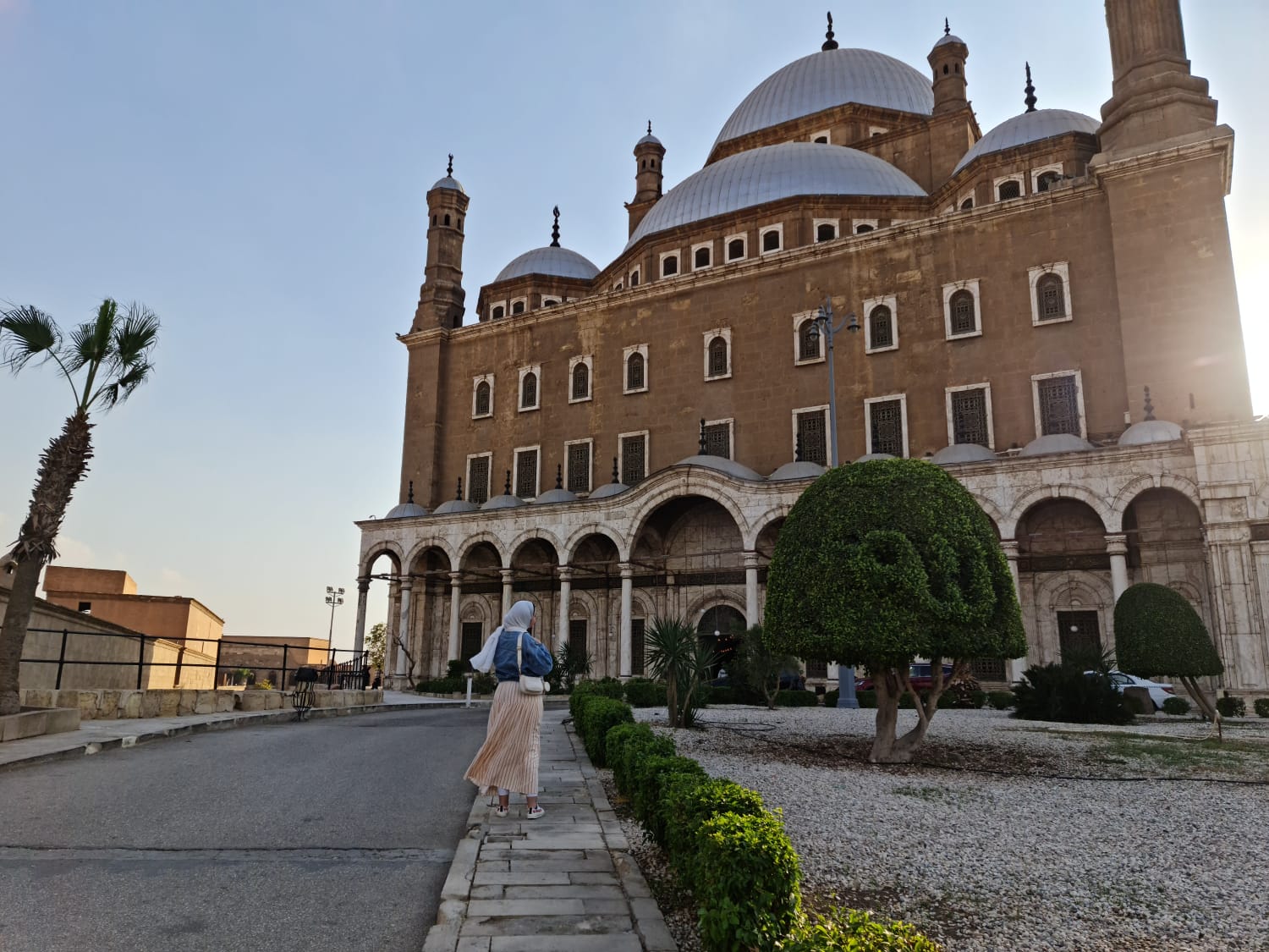 The Muhammad Ali Mosque and Cairo Citadel exterior with domes and minarets at sunset