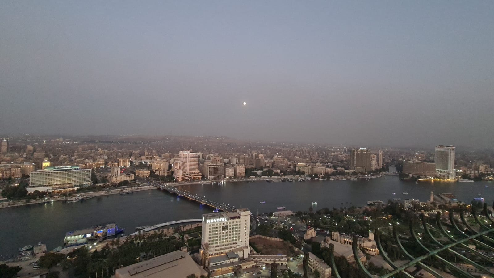 Twilight moonrise over the Nile and central Cairo skyline
