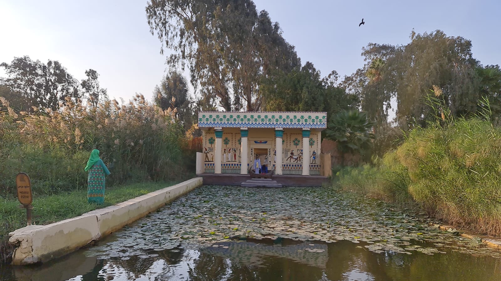Traditional Egyptian temple replica by the lotus pond at the Pharaonic Village